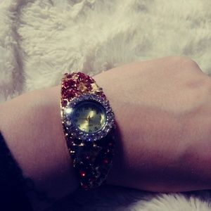 Bracelet watch w/ ruby gemstones and CZ